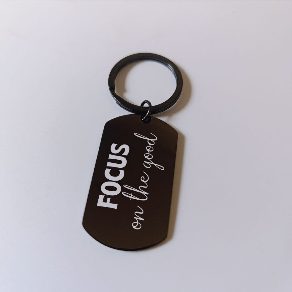 Focus on the good black keychain