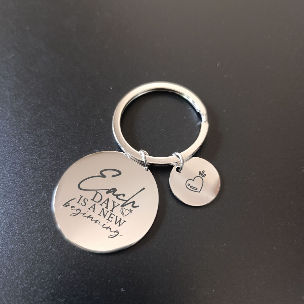 Each day is a new beginning keychain